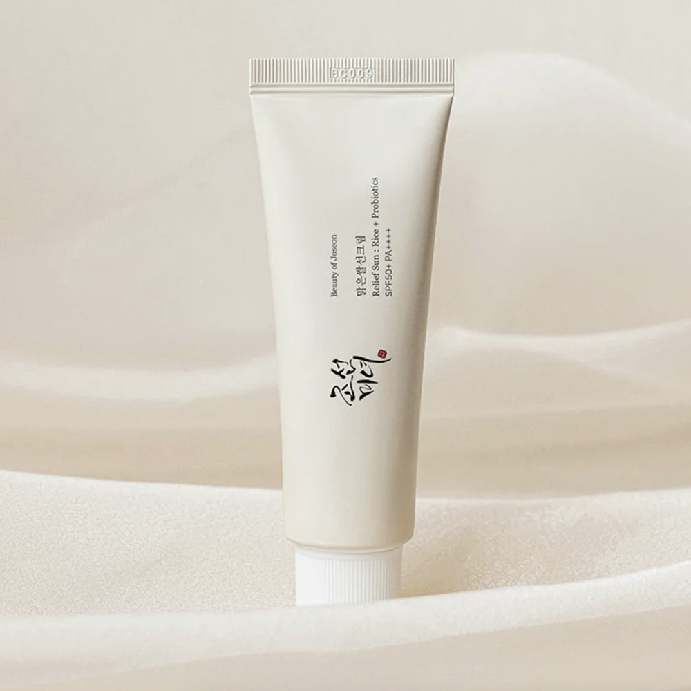 Skincare tube with text on a beige background BEAUTY OF JOSEON