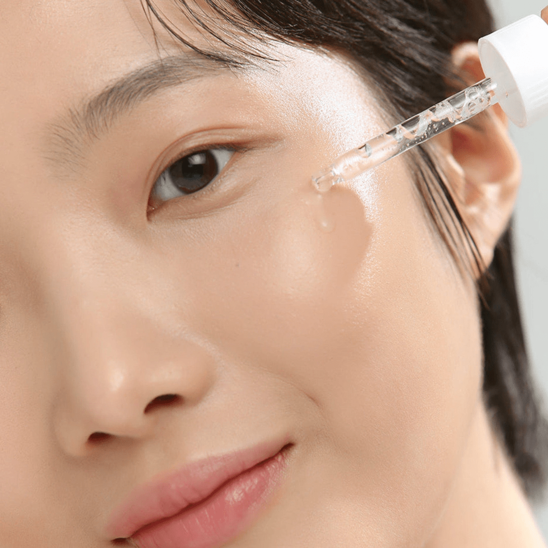 Close-up of a person applying a skincare product to their face. beauty of joseon