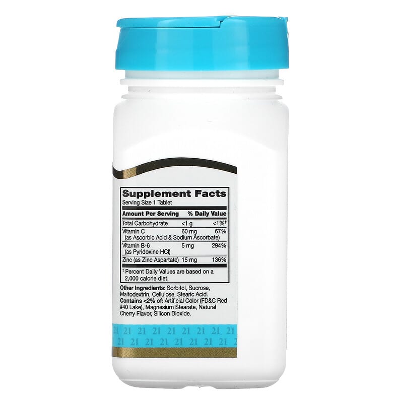 Supplement bottle with blue cap and white label on a white background