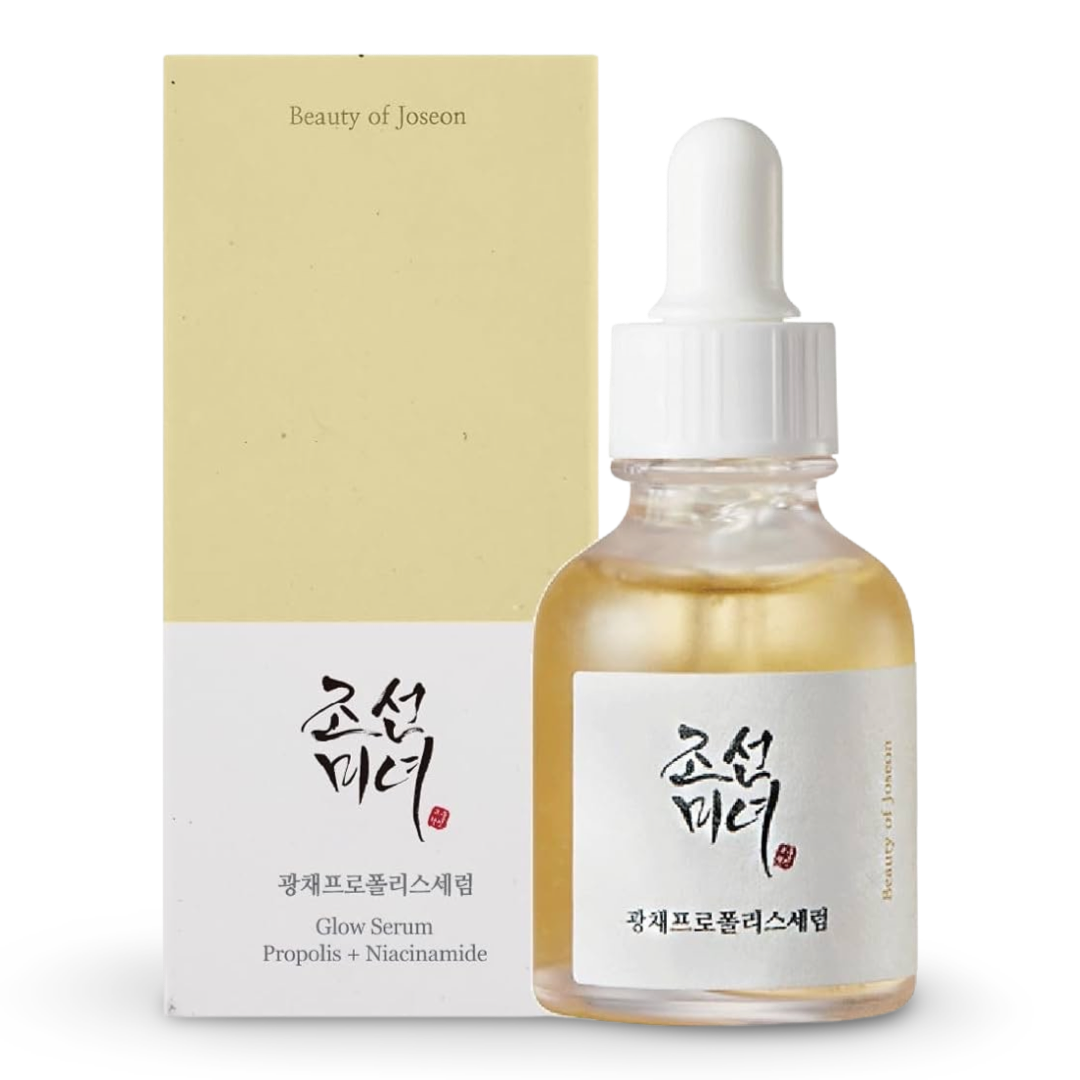 Beauty serum bottle with dropper and packaging on a white background