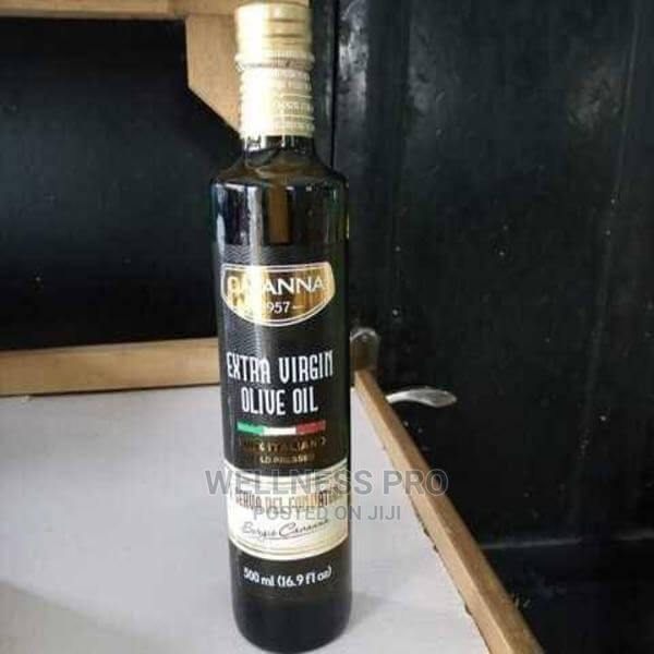 Bottle of CAVANNA extra virgin olive oil on a black background