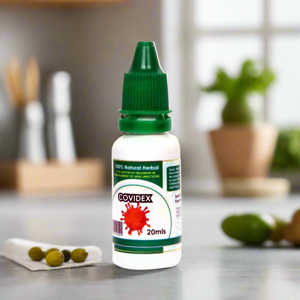 Bottle labeled 'Covidx' on a kitchen counter with blurred background