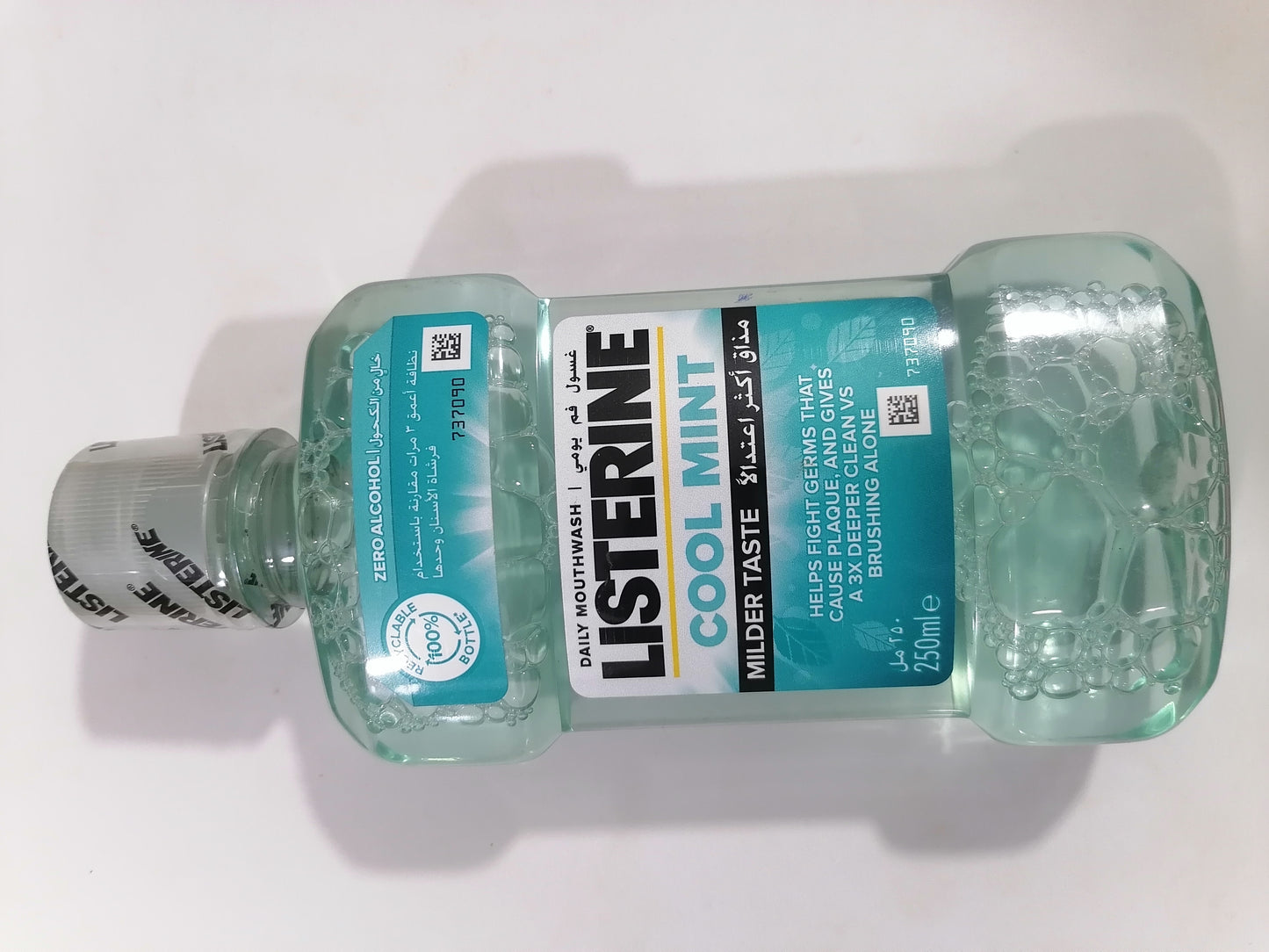 Bottle of Listerine Cool Mint mouthwash on a white background