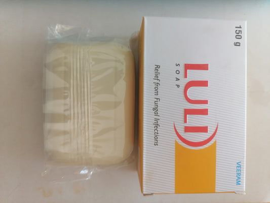Bar of LULI soap next to its packaging on a white background