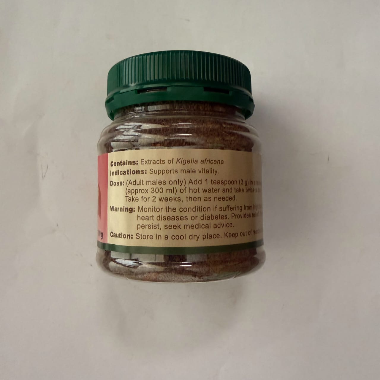 Jar of herbal supplement with label on a white background