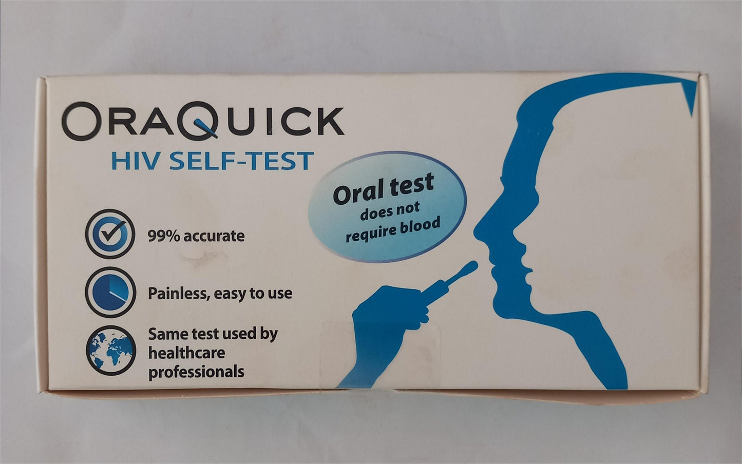 OraQuick HIV self-test kit packaging on a gray background