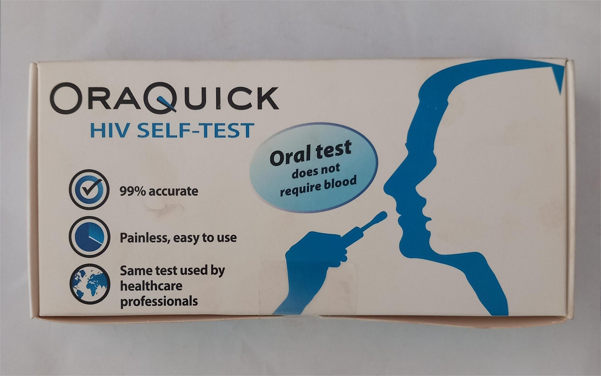 OraQuick HIV self-test kit packaging on a gray background