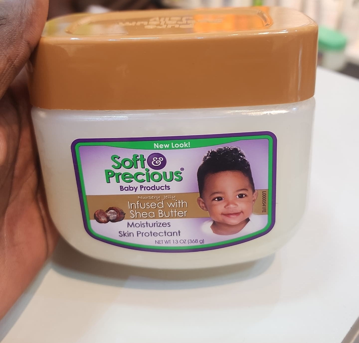 Jar of Soft & Precious baby products on a white surface