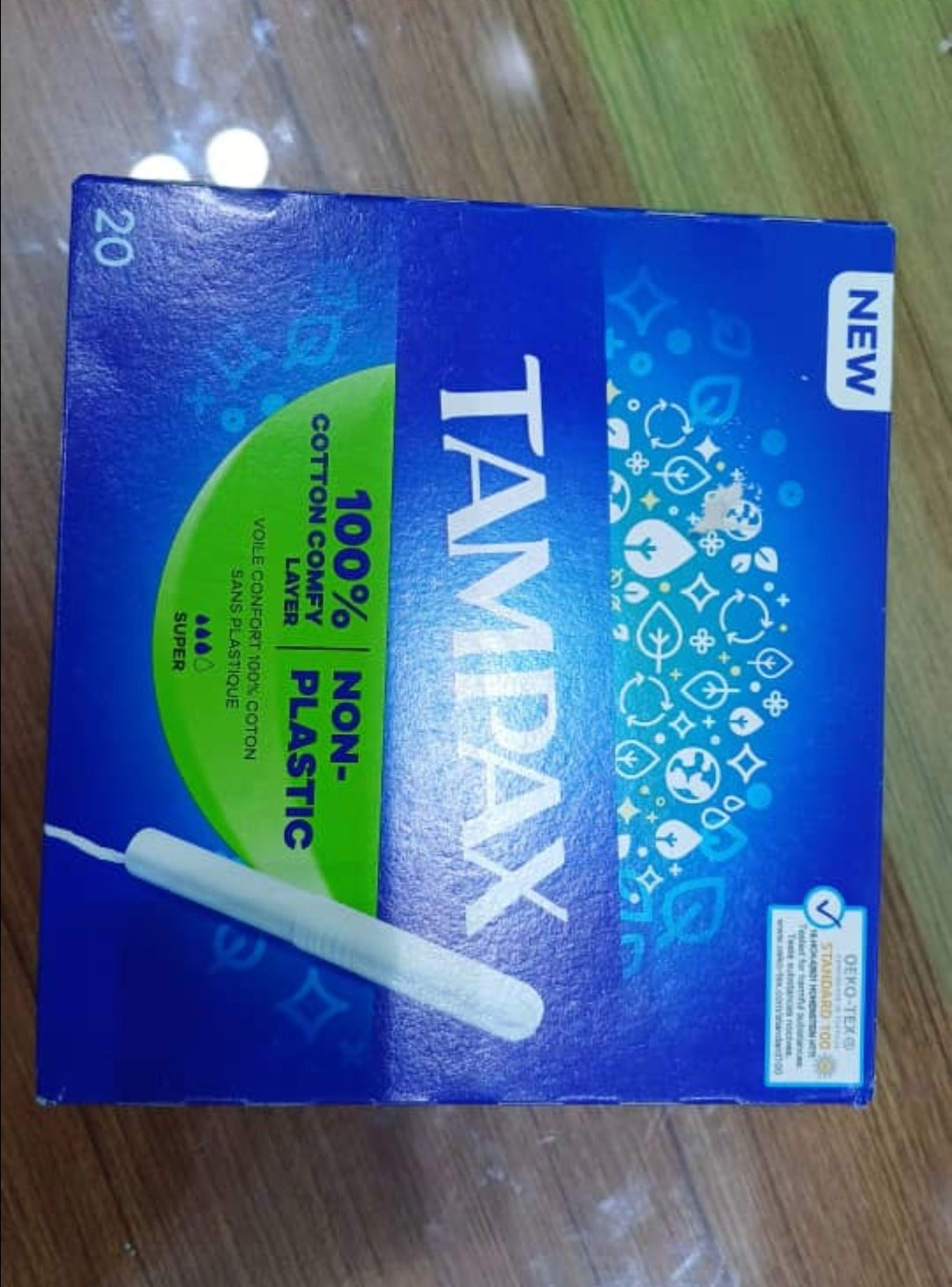 Tampax box on a wooden surface