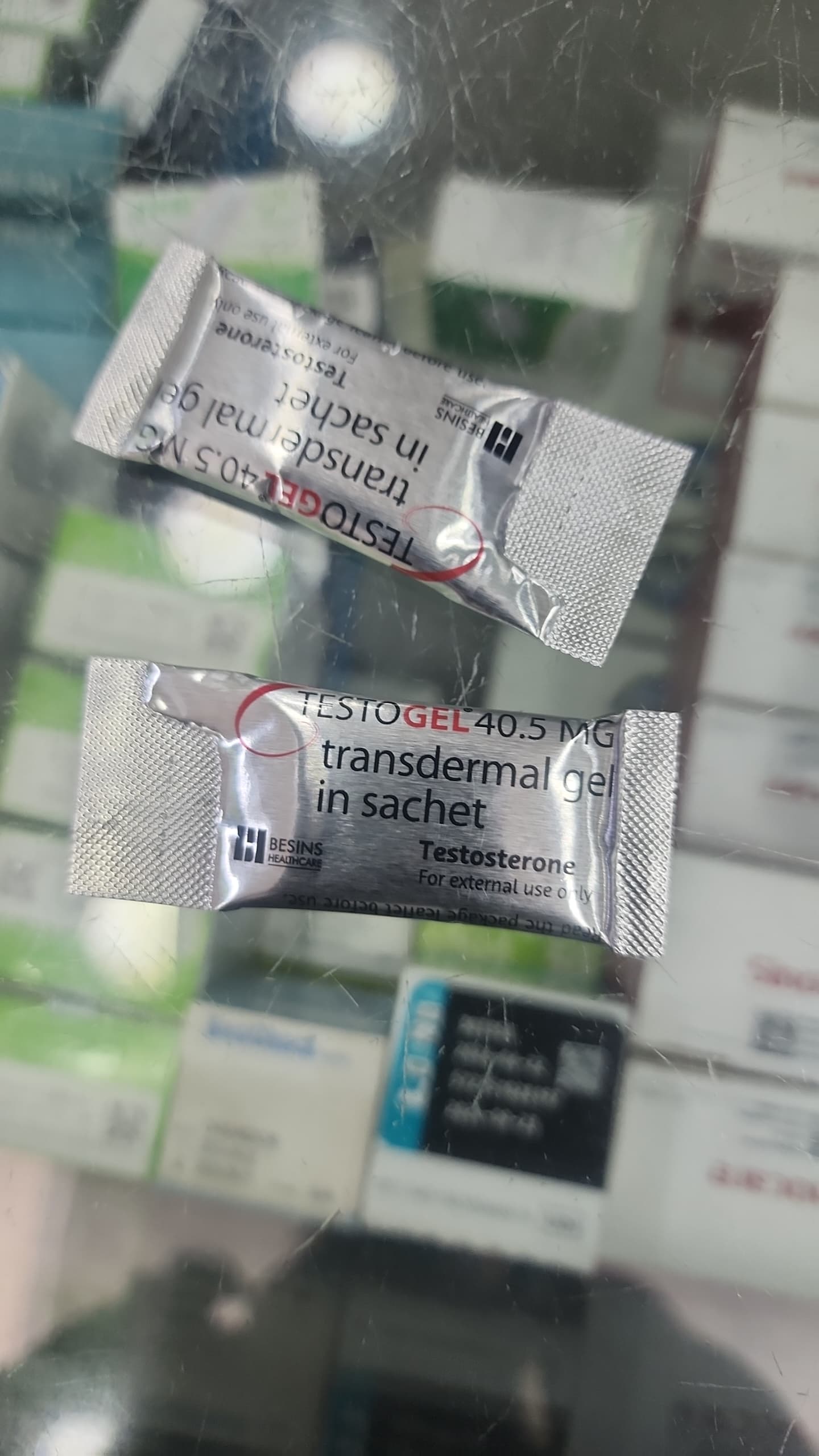 Two packages of Testogel transdermal gel on a blurred background