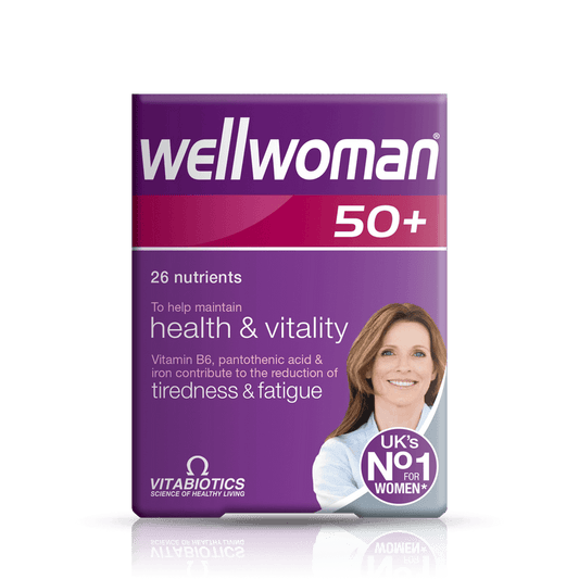 Purple packaging of wellwoman 50+ supplement with a woman's face on a green background